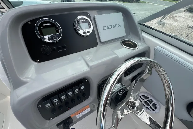Slide: The Image of 2026 Robalo R207 Dual Console dashboard with Garmin display and Yamaha gauges. - 17