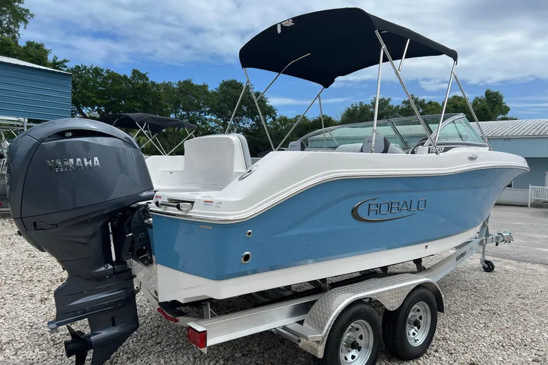 Slide: The Image of 2026 Robalo R207 Dual Console boat with Yamaha engine on trailer. - 4