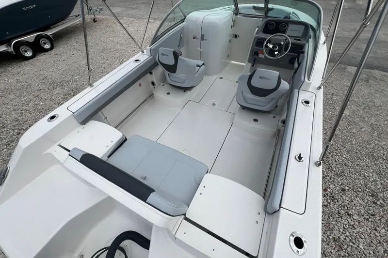 Slide: The Image of 2026 Robalo R207 Dual Console boat interior with seating and steering wheel. - 9