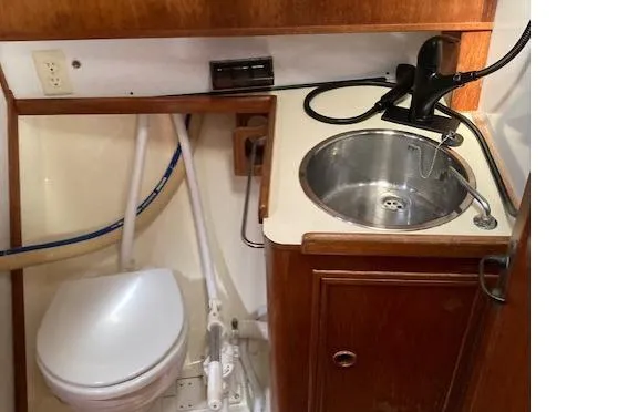 Slide: The Image of 1983 Wauquiez 38 yacht bathroom with sink and toilet. - 14
