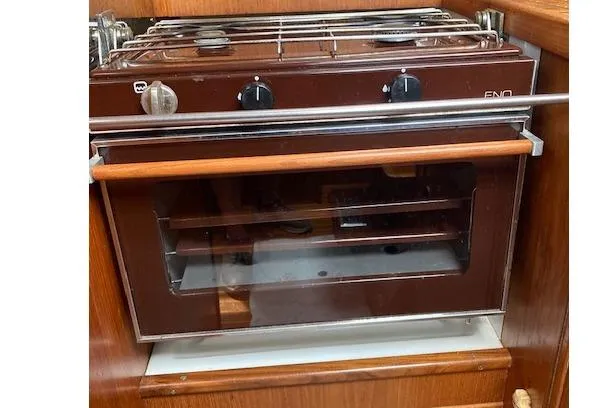 Slide: The Image of Vintage 1983 Wauquiez 38 boat oven with brown finish and control knobs. - 9