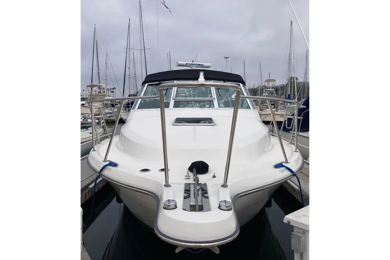 Slide: The Image of 2002 Tiara Yachts 2900 Open docked at marina, front view. - 16