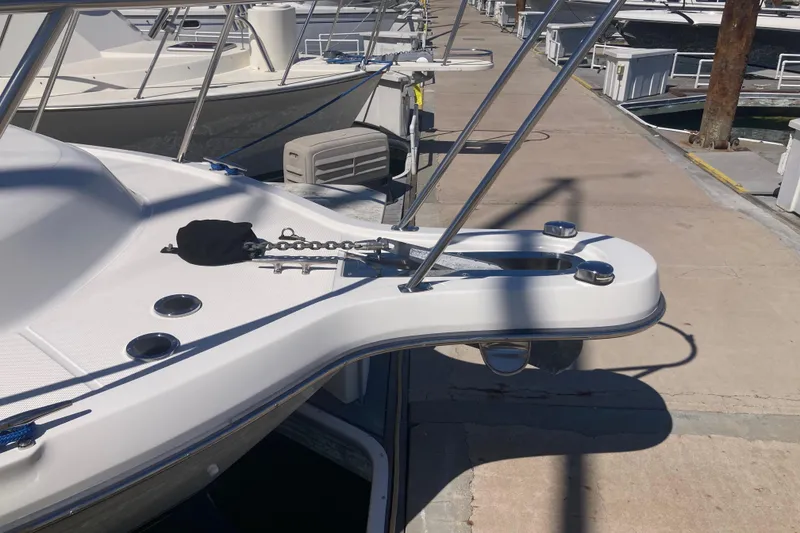 Slide: The Image of 2002 Tiara Yachts 2900 Open docked, showcasing bow and anchor chain. - 17
