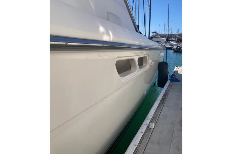 Slide: The Image of 2002 Tiara Yachts 2900 Open docked at marina, side view. - 30