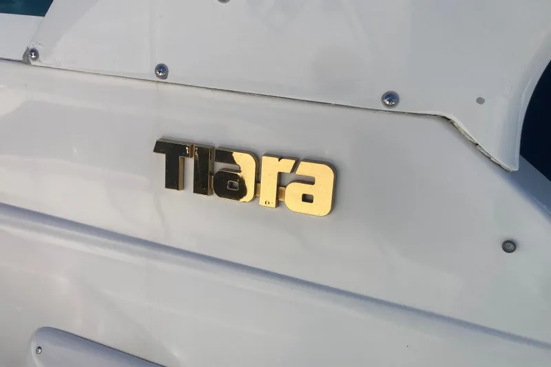 Slide: The Image of Gold "Tiara" logo on a 2002 Tiara Yachts 2900 Open boat. - 32