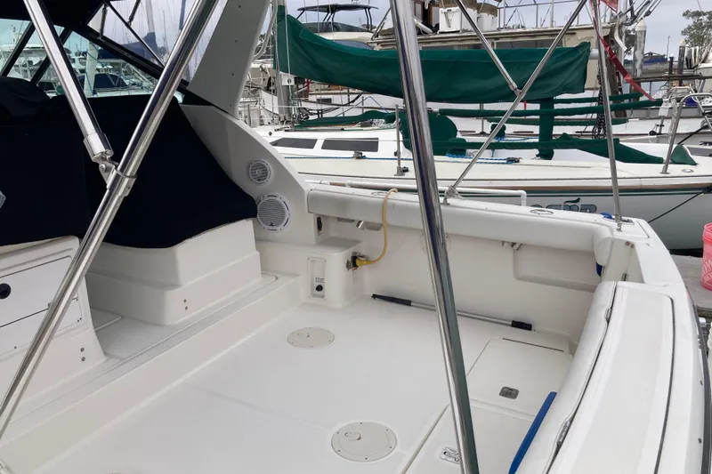 Slide: The Image of 2002 Tiara Yachts 2900 Open boat interior, featuring spacious deck and seating area. - 35