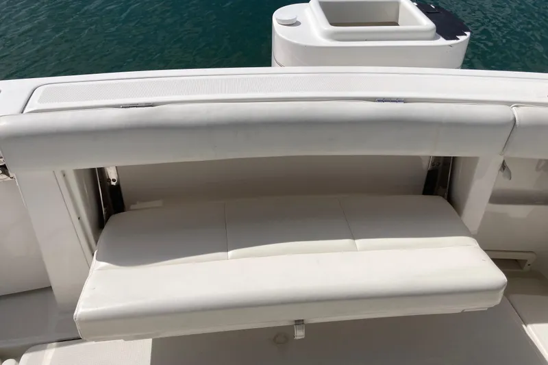 Slide: The Image of 2002 Tiara Yachts 2900 Open boat with white cushioned seating and water backdrop. - 41