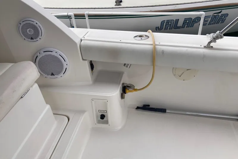 Slide: The Image of 2002 Tiara Yachts 2900 Open boat interior with speakers and utility connections. - 42
