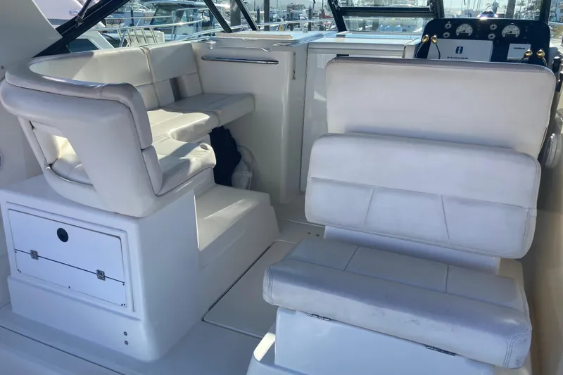 Slide: The Image of 2002 Tiara Yachts 2900 Open interior with white seating and control panel. - 45