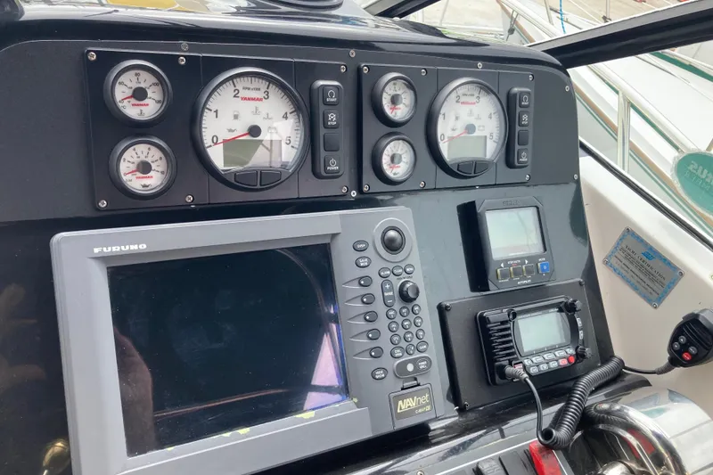 Slide: The Image of Dashboard of a 2002 Tiara Yachts 2900 Open with navigation and control instruments. - 50