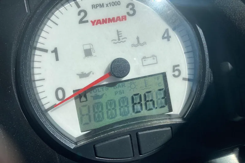 Slide: The Image of Close-up of Yanmar tachometer on 2002 Tiara Yachts 2900 Open, displaying engine RPM and metrics. - 51