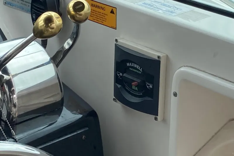 Slide: The Image of Control panel of a 2002 Tiara Yachts 2900 Open, featuring Maxwell waterproof switch. - 52