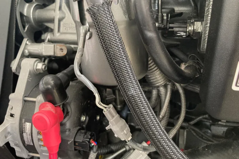 Slide: The Image of Engine components of a 2002 Tiara Yachts 2900 Open, featuring wiring and connectors. - 78