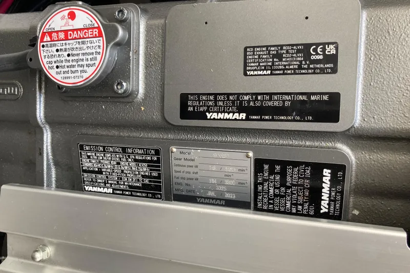 Slide: The Image of Yanmar engine labels on a 2002 Tiara Yachts 2900 Open, displaying safety and compliance information. - 81