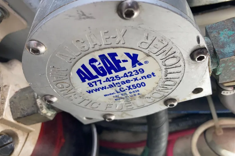 Slide: The Image of Algae-X magnetic fuel conditioner on 2002 Tiara Yachts 2900 Open. - 82