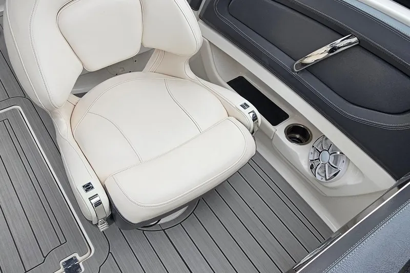 Slide: The Image of 2018 Chaparral 257 SSX boat interior with white seat and speaker. - 15