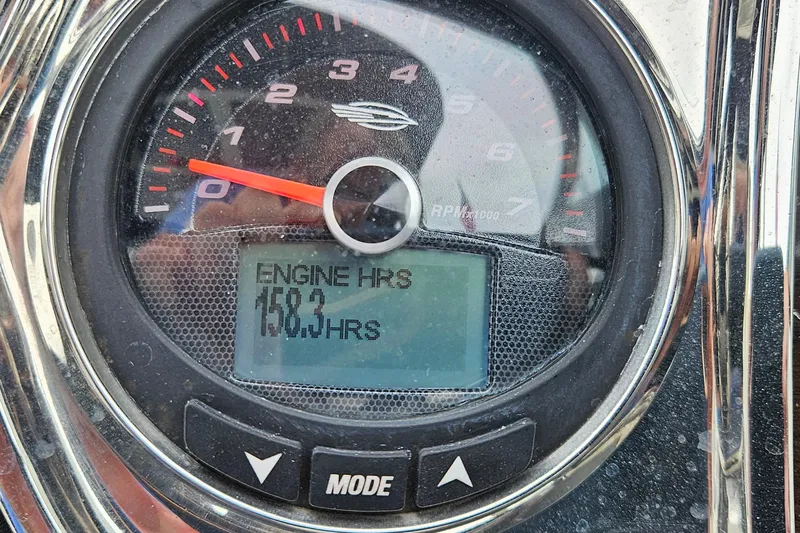 Slide: The Image of 2018 Chaparral 257 SSX engine hours gauge showing 158.3 hours. - 5