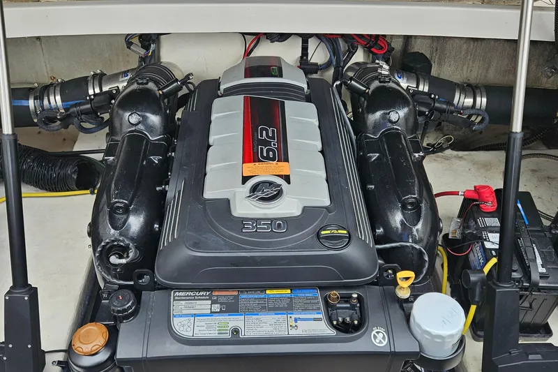 Slide: The Image of Engine compartment of a 2018 Chaparral 257 SSX boat, featuring a Mercury 6.2L engine. - 6