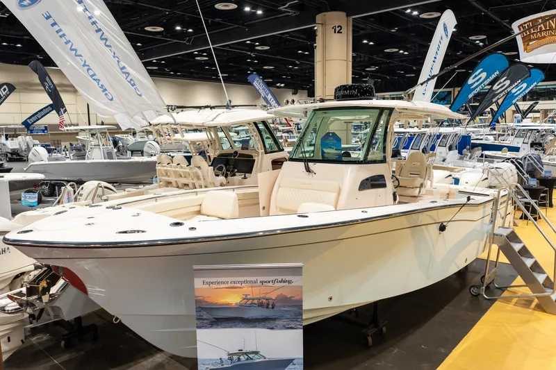 The Image of 2026 Grady-White Canyon 306 boat displayed at a marine exhibition. - 0