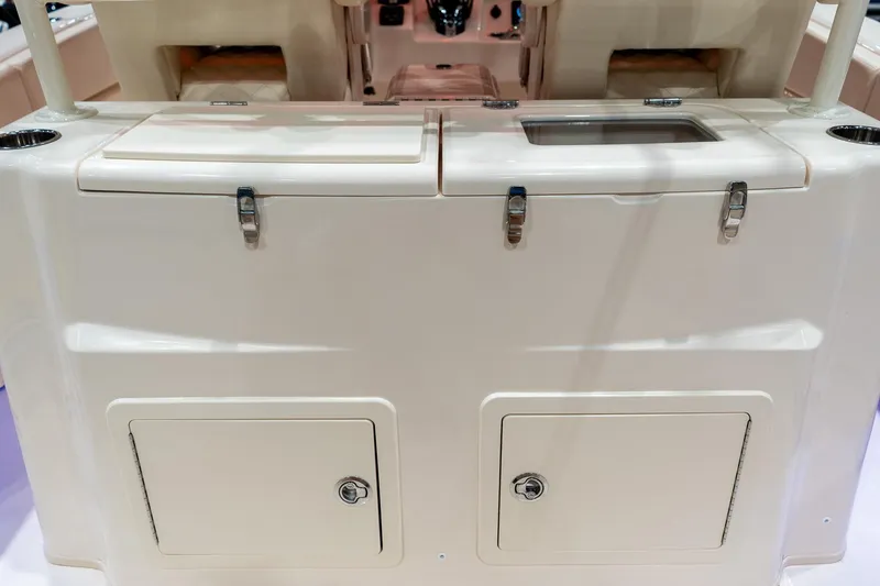 Slide: The Image of 2026 Grady-White Canyon 306 boat interior with storage compartments and seating. - 16