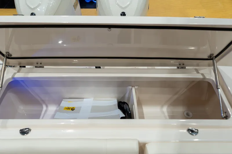 Slide: The Image of Open storage compartment on 2026 Grady-White Canyon 306 boat, showcasing interior space. - 19