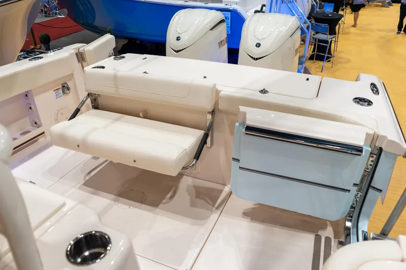 Slide: The Image of 2026 Grady-White Canyon 306 boat interior with foldable seating and dual outboard motors. - 20