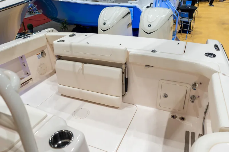 Slide: The Image of 2026 Grady-White Canyon 306 boat interior with seating and storage compartments. - 21