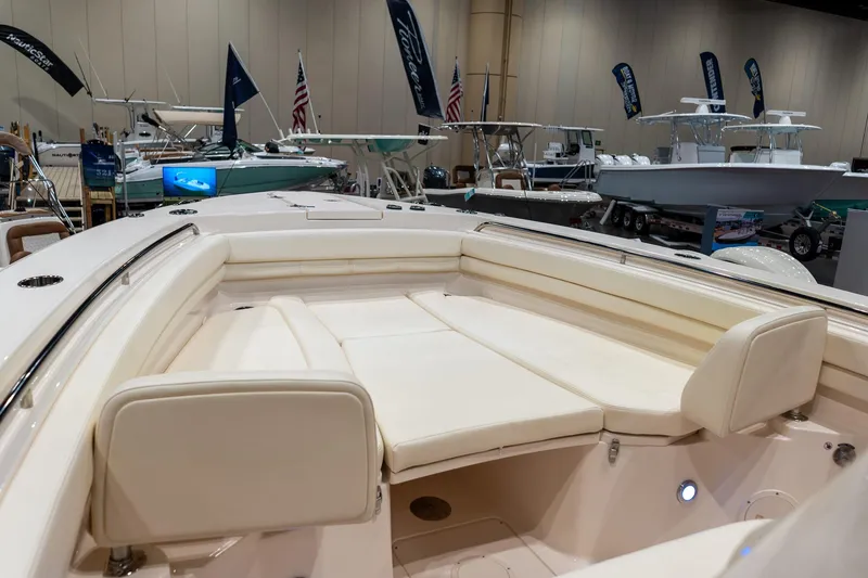 Slide: The Image of 2026 Grady-White Canyon 306 boat interior at a boat show display. - 22