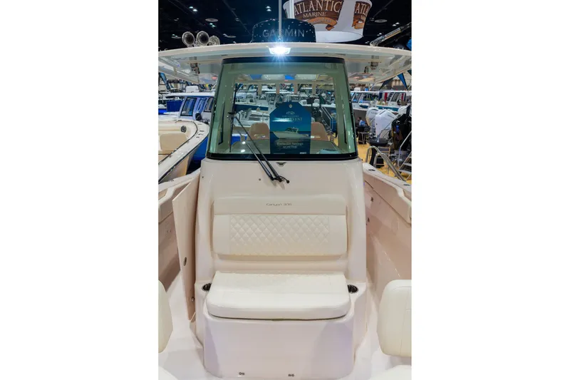 Slide: The Image of 2026 Grady-White Canyon 306 boat interior at a marine exhibition. - 23