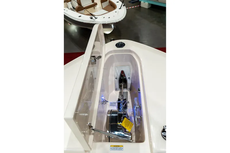 Slide: The Image of Anchor compartment of 2026 Grady-White Canyon 306 boat, showcasing storage and equipment. - 25