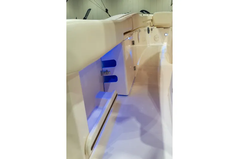 Slide: The Image of 2026 Grady-White Canyon 306 boat interior with blue LED lighting. - 28