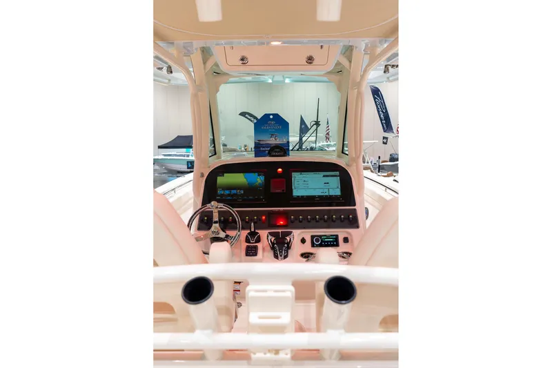Slide: The Image of 2026 Grady-White Canyon 306 boat dashboard with advanced navigation and control systems. - 5