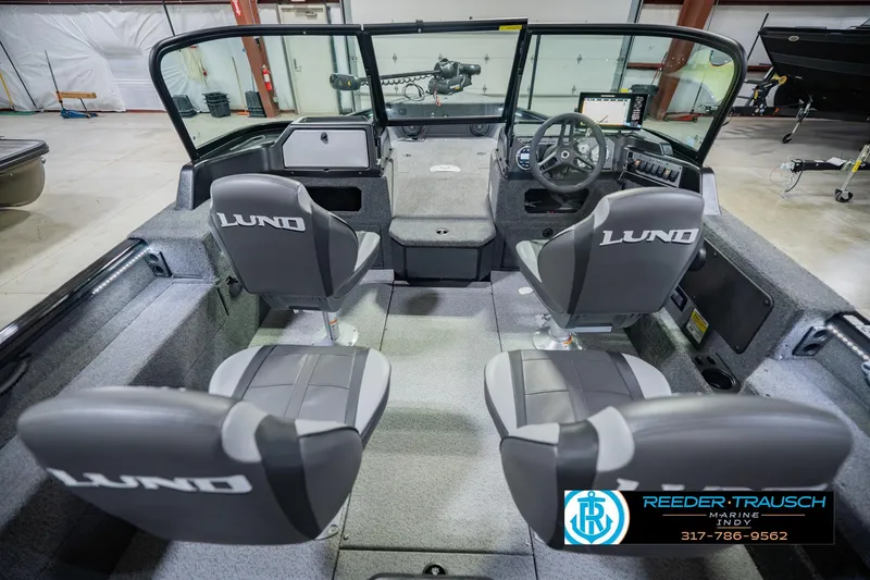 Slide: The Image of 2026 Lund 1775 Impact XS boat interior with dual seats and steering console. - 15