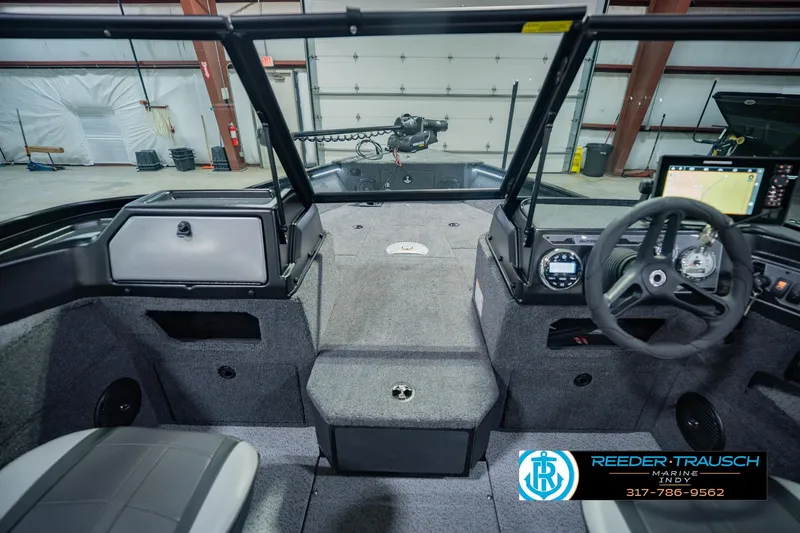 Slide: The Image of Interior view of 2026 Lund 1775 Impact XS boat with steering wheel and dashboard. - 16