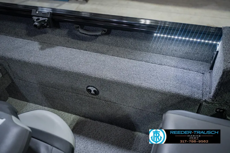 Slide: The Image of 2026 Lund 1775 Impact XS boat interior with gray carpet and seating. - 25