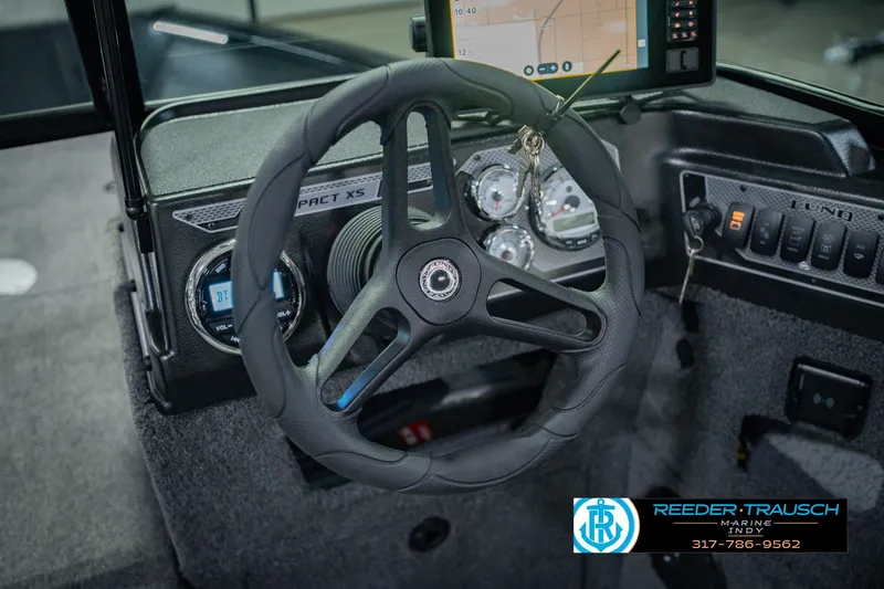 Slide: The Image of Steering wheel and dashboard of 2026 Lund 1775 Impact XS boat. - 32