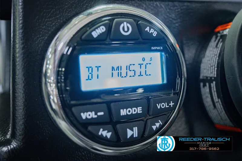 Slide: The Image of Audio control panel displaying "BT Music" in a 2026 Lund 1775 Impact XS boat. - 34