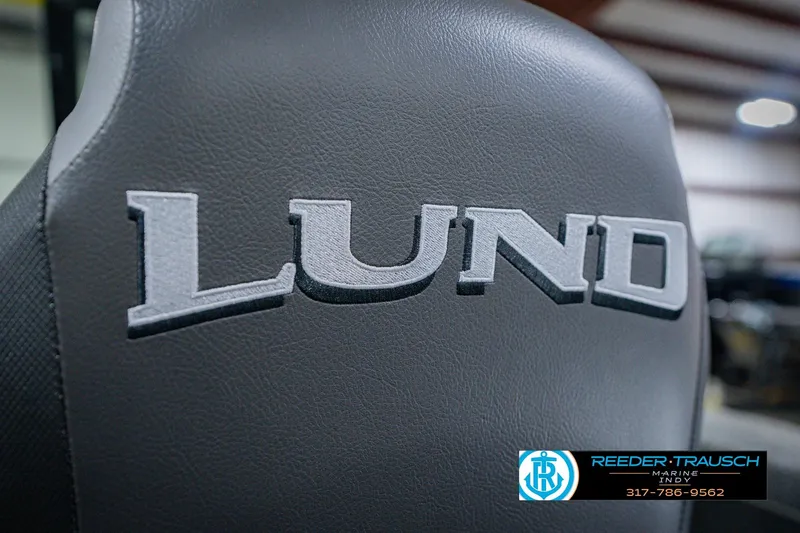 Slide: The Image of 2026 Lund 1775 Impact XS boat seat with logo, featuring Reeder-Trausch Marine contact details. - 43