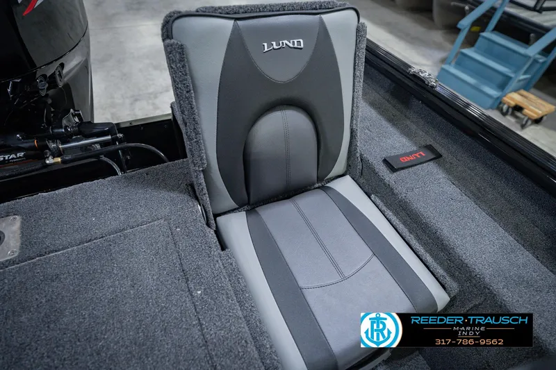 Slide: The Image of 2026 Lund 1775 Impact XS boat seat with gray upholstery and branding details. - 46