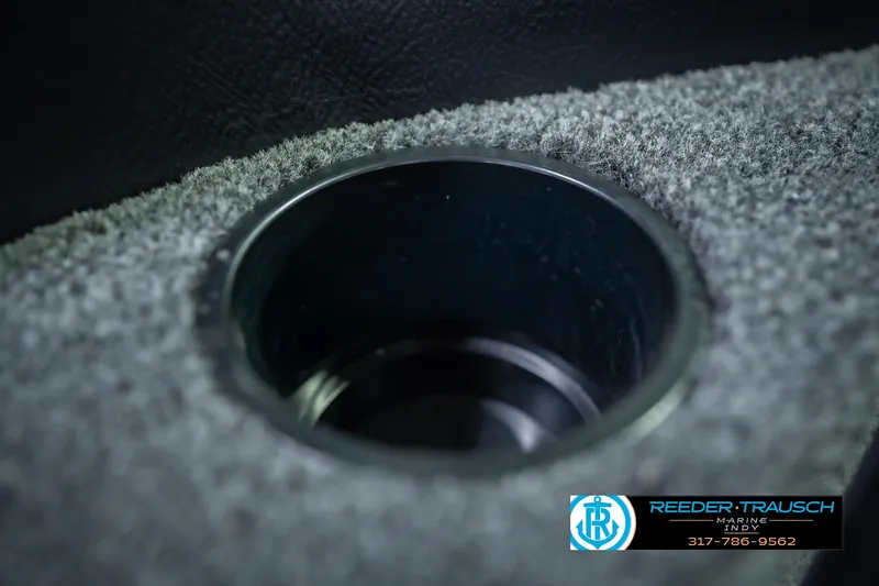 Slide: The Image of Cup holder in 2026 Lund 1775 Impact XS boat, featuring carpeted interior. - 47