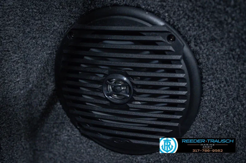 Slide: The Image of Close-up of a speaker in a 2026 Lund 1775 Impact XS boat interior. - 48