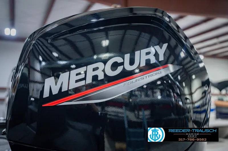 Slide: The Image of 2026 Lund 1775 Impact XS with Mercury FourStroke engine in a showroom. - 51