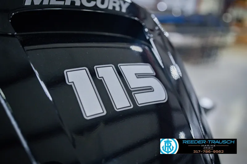 Slide: The Image of Close-up of a Mercury 115 engine on a 2026 Lund 1775 Impact XS boat. - 52