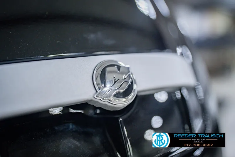 Slide: The Image of Close-up of 2026 Lund 1775 Impact XS logo on a sleek black surface. - 53