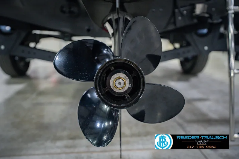 Slide: The Image of Close-up of a 2026 Lund 1775 Impact XS boat propeller in a showroom. - 54