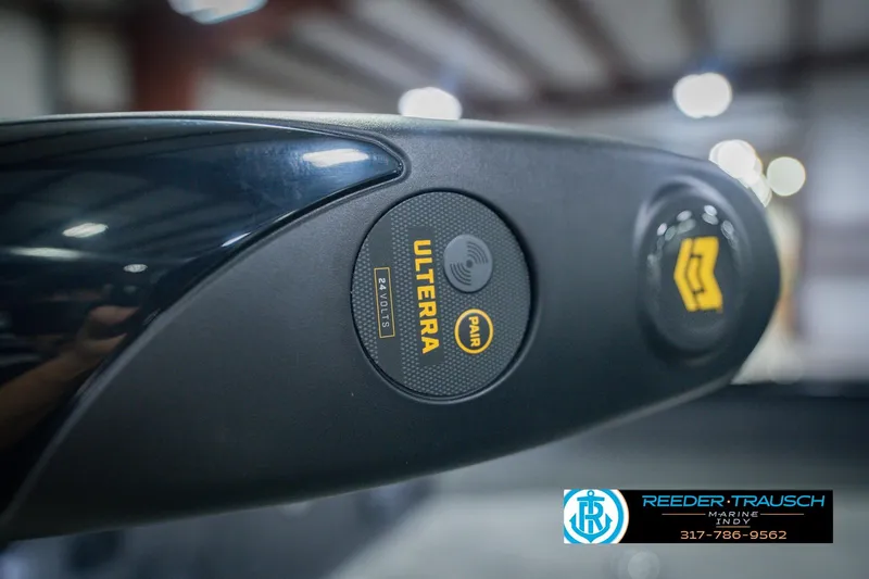 Slide: The Image of Close-up of a 2026 Lund 1775 Impact XS boat control panel with Ulterra branding. - 56