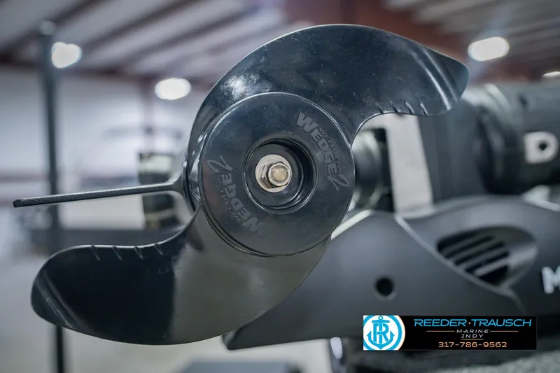 Slide: The Image of Close-up of a 2026 Lund 1775 Impact XS boat propeller in a showroom. - 58
