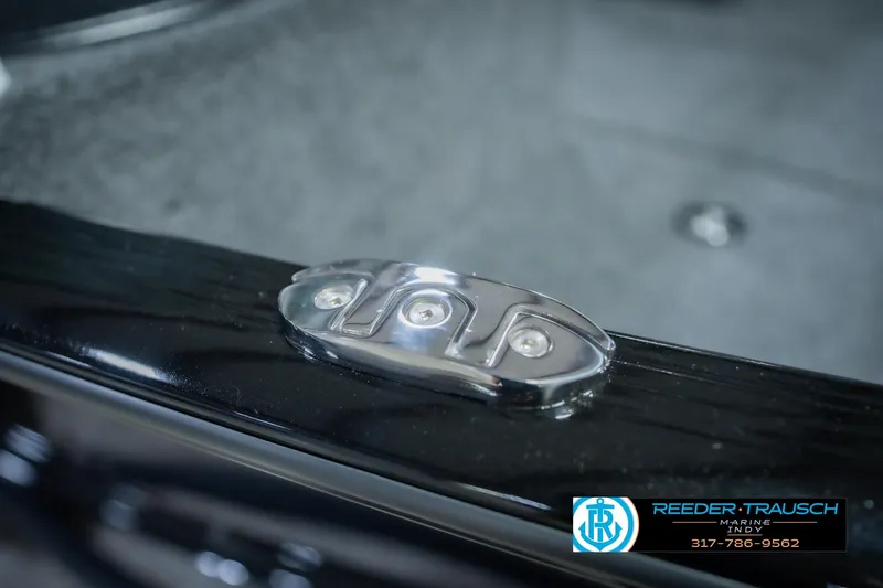 Slide: The Image of Close-up of 2026 Lund 1775 Impact XS boat detail with Reeder Trausch Marine logo. - 71