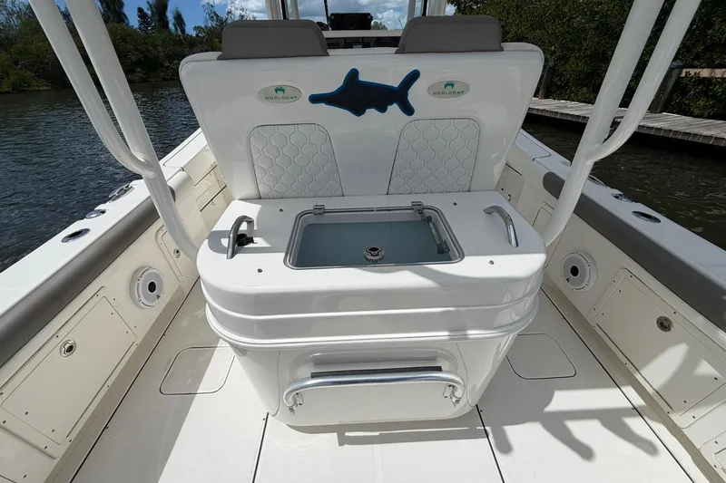 Slide: The Image of 2020 World Cat 295 CC boat interior with seating and storage, featuring sleek design elements. - 13