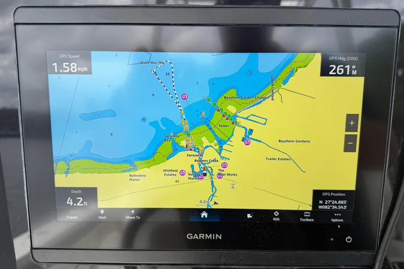 Slide: The Image of Garmin GPS display on 2020 World Cat 295 CC showing Sarasota Bay navigation map. - 21